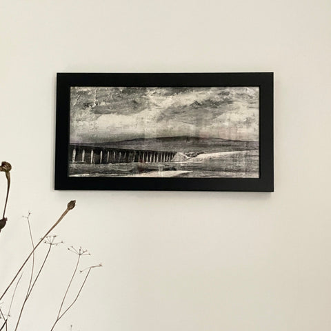 Journey contemporary landscape fine art print framed in black on wall with minimal decor
