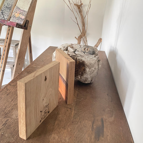 Side corner detail of natural oak art in studio with natural materials