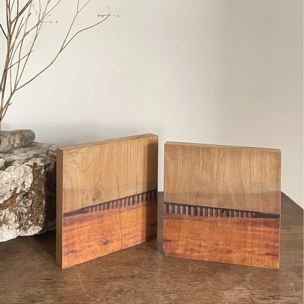 Clean soft minimalistic original abstracted landscape art on wood table with limestone and organic natural forms for restorative grounding interiors - The Art of Sanctuary